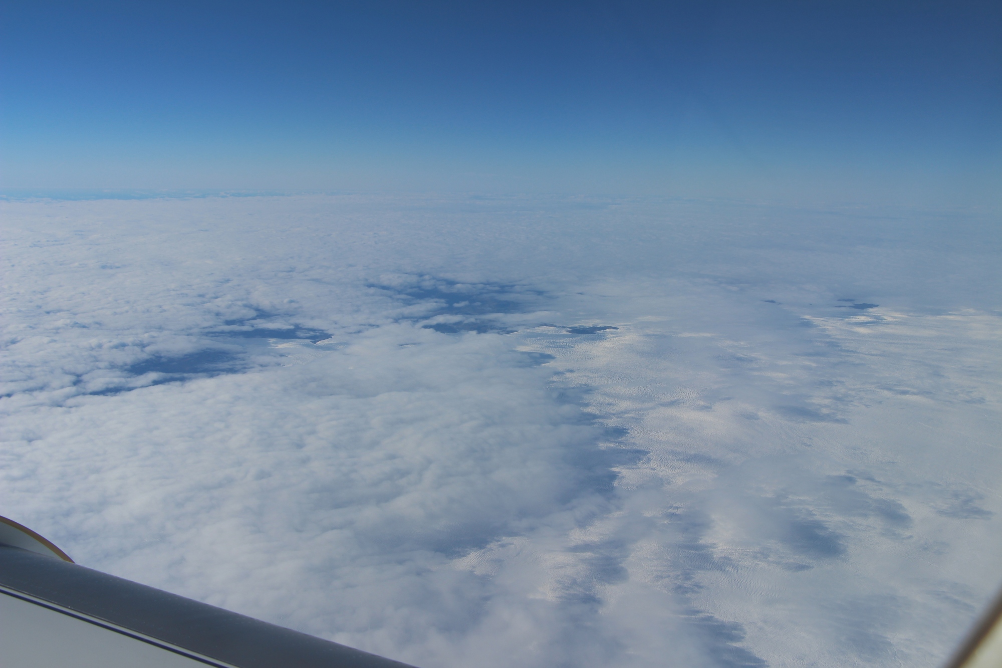 Margin of ice sheet with clouds NASA Airborne Science Program