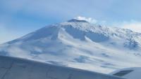 Antarctic volcano Mount Erebus seen over the NASA P-3's right wing