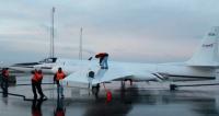 Ground crew members load fuel aboard NASA's ER-2 research aircraft in Iceland