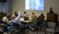 Researchers review proposed IceBridge flight lines during mission’s science team meeting at NASA Goddard