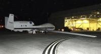 NASA's unmanned Global Hawk is pushed out of a hangar on Andersen Air Force Base, Guam, in preparation for an ATTREX science flight over the Western Pacific.