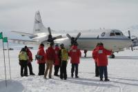 Members of the IceBridge team greet the NASA P-3 after its first landing on McMurdo Station’s sea ice runway.