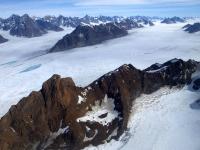 Upper part of Midgard Glacier system in southeast Greenland. Photo taken during NASA's Operation IceBridge Helheim-Kangerdlugssuap Gap B mission on May 17, 2016. Credits: NASA/Maria-José Viñas