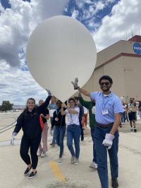 SARP students carry an ozone sonde balloon to launch at NASA’s Armstrong Flight Research Center in Palmdale, California.