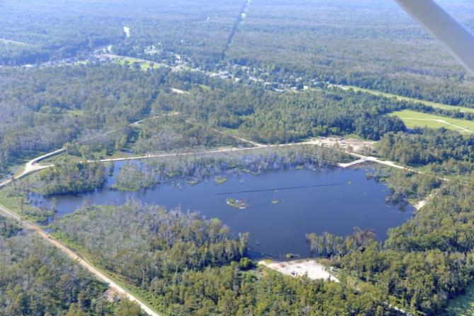 Aerial photo of a 25-acre sinkhole that formed unexpectedly near Bayou Corne, La., in Aug. 2012. Image Credit:  On Wings of Care, New Orleans, La.
