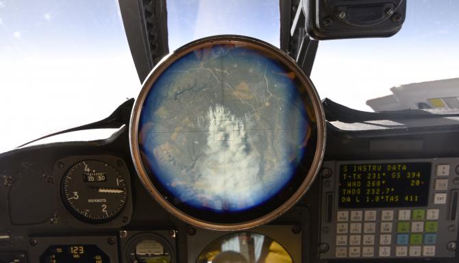 The cock-pit view finder in the ER-2 shows a controlled fire burning near Flagstaff, Arizona on Nov. 7, 2017. This small fire event offered the ACEPOL science team a different test environment to observe with the polarimeter and lidar instruments onboard the aircraft. Credits: NASA / Stu Broce