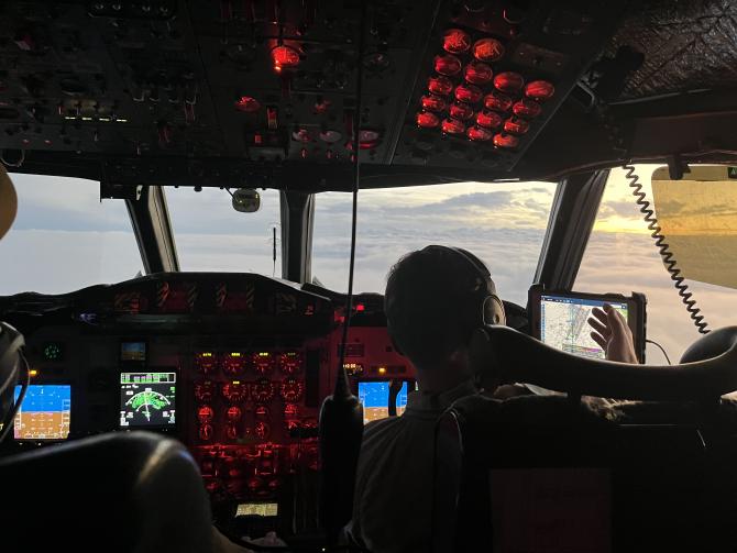The pilots navigate the plane along the flight path as the sun begins to set for the day. Credit: Erica McNamee