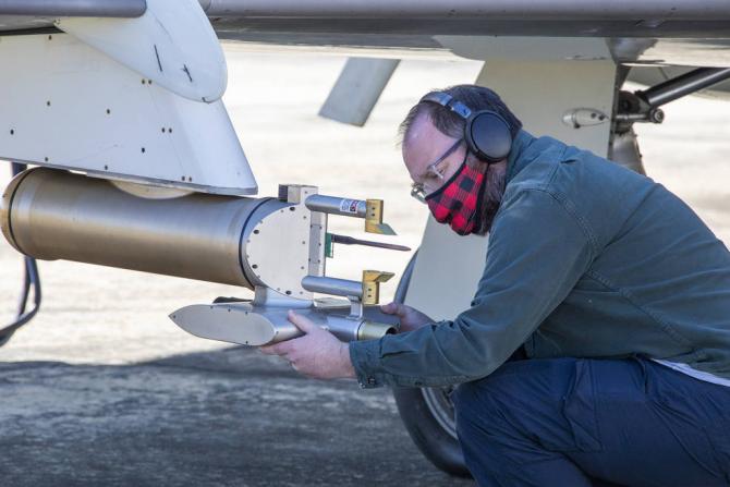 Researcher Luke Ziemba checks an instrument on the Falcon prior to a flight. Credits: NASA/David C. Bowman