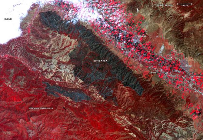 Captured by the ASTER instrument aboard NASA's Terra satellite, this false-color map shows the burn area of the River and Carmel fires in Monterey County, California. Vegetation (including crops) is shown in red; the burn area (dark blue/gray) is in the center of the image. Credits: NASA/METI/AIST/Japan Space Systems
