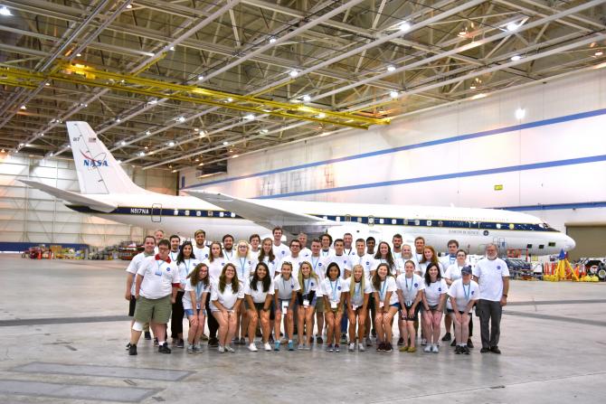 Students, mentors and faculty of the 2018 NASA Student Airborne Research Program pose in front of the NASA DC-8
