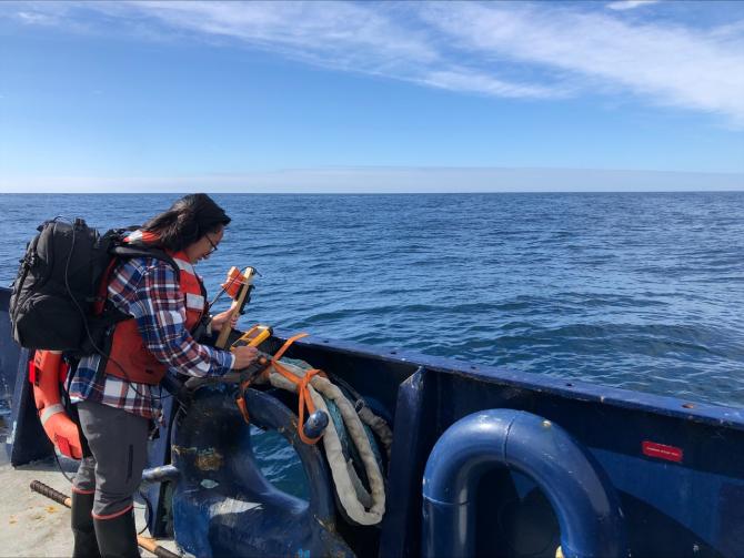 Kelly Luis, a NASA Postdoctoral Program Fellow at NASA’s Jet Propulsion Laboratory in Southern California, uses a handheld instrument called the Spectral Evolution to measure water color during the Sub-Mesoscale Ocean Dynamics Experiment (S-MODE) mission. Image Credit: NASA/Avery Snyder