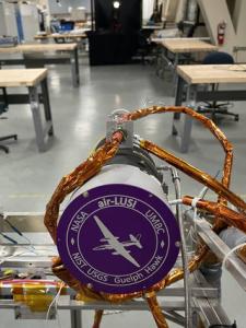 Shown is the air-LUSI telescope positioned to measure a simulated Moon in a laboratory for testing and calibration before and after the flight campaign.