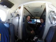 NASA Langley team members Richard Hare, left, and David Harper aboard Langley's UC-12. The team used an instrument called High Spectral Resolution Lidar, or HSRL-1, to collect data on the vertical distribution of phytoplankton in the Atlantic Ocean.