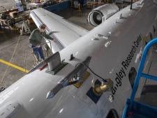 The HU-25 Falcon, pictured here, will fly under and through the clouds, where a suite of instruments will take samples directly from the surrounding air to measure everything from aerosol properties to droplet composition to gas. Instrument probes are visible here protruding from the top of the aircraft. Credits: NASA/David C. Bowman