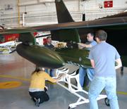 AJAX team mounting instrument onto AlphaJet
