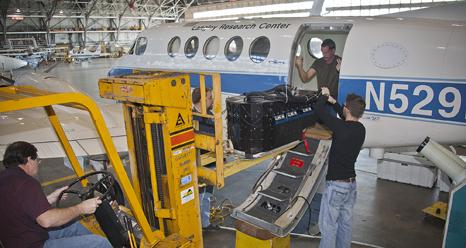 Technicians at NASA's Langley Research Center in Hampton, Va., prepare a B200 aircraft for the DISCOVER-AQ air pollution measurement mission in California. 