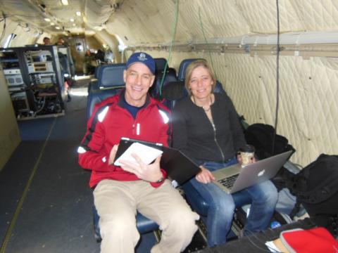 Teachers Mark Buesing and Jette Poulsen aboard the NASA P-3B during an IceBridge survey flight