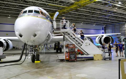 Students climb onboard the NASA DC-8