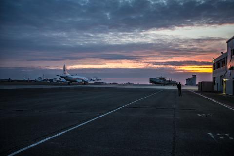 The NASA P-3 Orion aircraft departs the Wallops Facility as the sun rises in the early morning. Credits: NASA/ Patrick Black