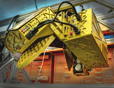 The HIWRAP dual frequency Doppler radar will hang under the Global Hawk. On the left, the golden disc is the antenna and on the right, the two small white discs are the radar beam transmitters, one for each of two frequencies. The whole apparatus spins while flying. 