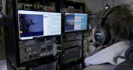 A research scientist monitors data measurements in-flight during the spring campaign of the ARCSIX mission. NASA/Gary Banziger