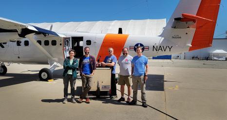 Members of the PACE-PAX team – from left to right, Cecile Carlson, Adam Ahern (NOAA), Dennis Hamaker (NPS), Luke Ziemba, and Michael Shook (NASA Langley Research Center) – in front of the Twin Otter aircraft as they prep for the start of the campaign. Credit: Judy Alfter/NASA